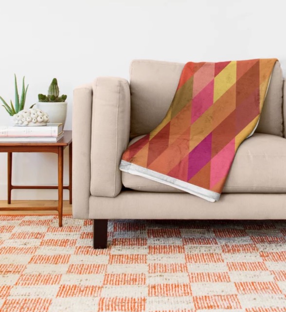 An orange harlequin throw blanket by Gingezel at Society6
